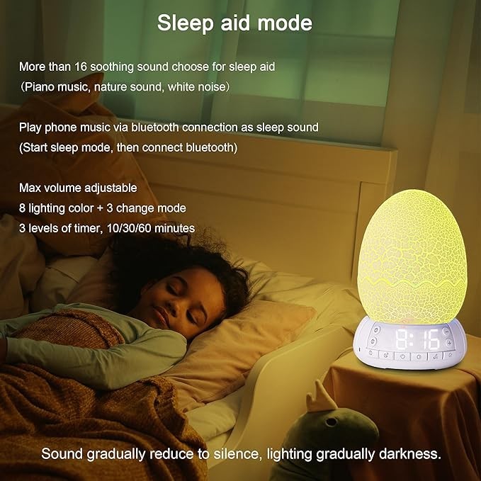 Sea Dragon Dreams dragon egg alarm clock with glowing yellow light and digital display on a bedside table near a child