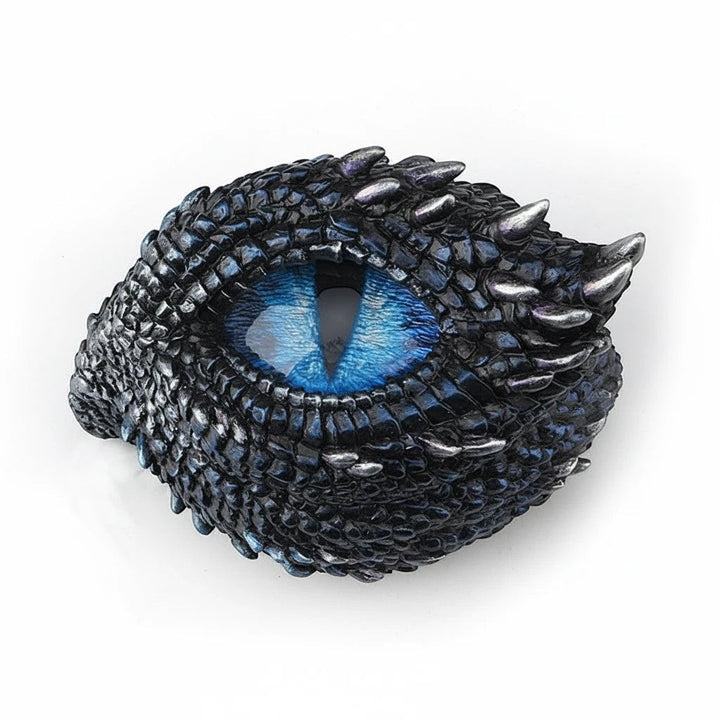 Sea Dragon Dreams polystone trinket box featuring a detailed blue dragon eye surrounded by dark thorny scales.