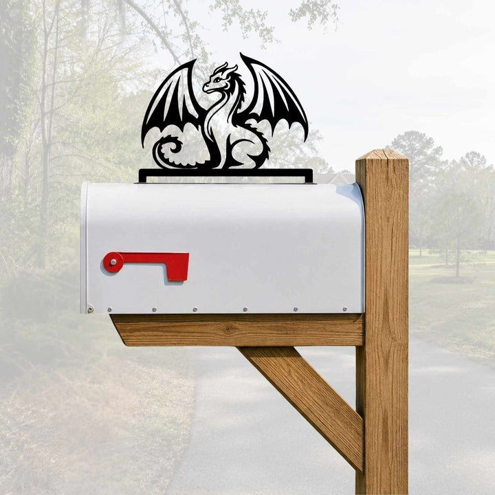Sea Dragon Dreams black metal dragon mailbox topper mounted on a white rural mailbox in a residential setting