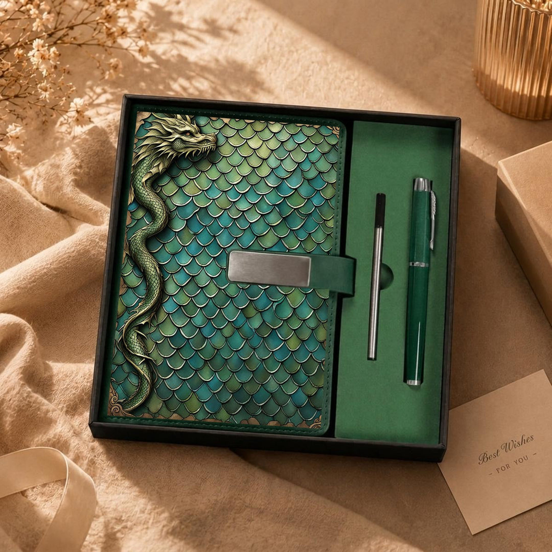 Sea Dragon Dreams notebook gift set with green dragon scale cover, 3D dragon emblem, and matching metal pen in box.