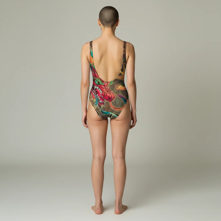Sea Dragon Dreams one-piece swimsuit with a vibrant red dragon print, featuring a low scoop back and cheeky fit.