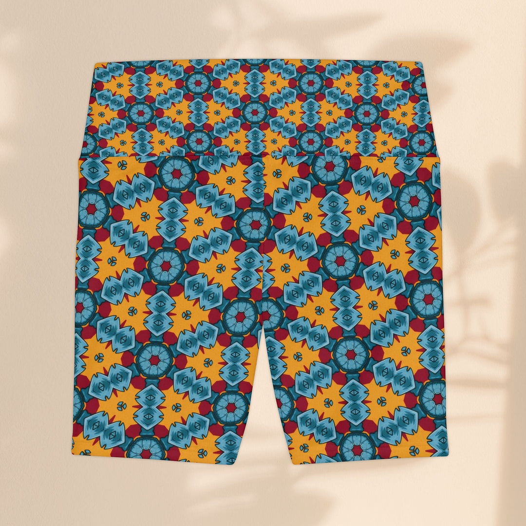 Sea Dragon Dreams workout shorts featuring a vibrant blue, red, and yellow street dragon geometric pattern.
