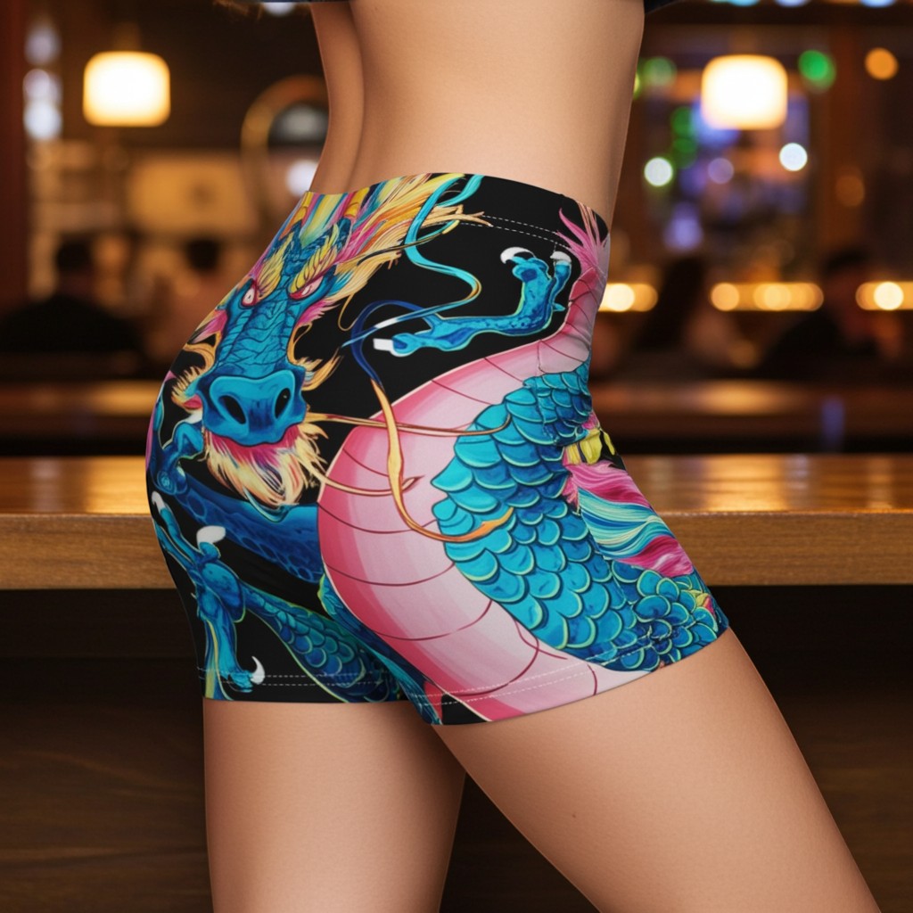 Sea Dragon Dreams women's skinny fit shorts featuring a vibrant blue and pink dragon print on a black background.