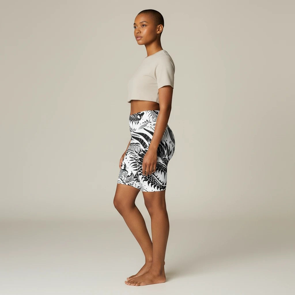 Model wearing Sea Dragon Dreams black and white dragon print polyester workout shorts for yoga and fitness