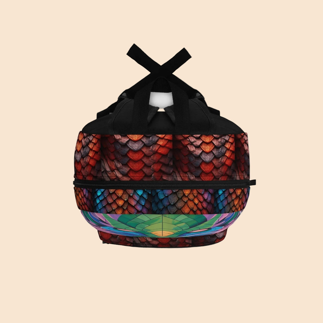 Sea Dragon Dreams backpack featuring a vibrant dragon eye graphic and textured red and blue dragon scales.