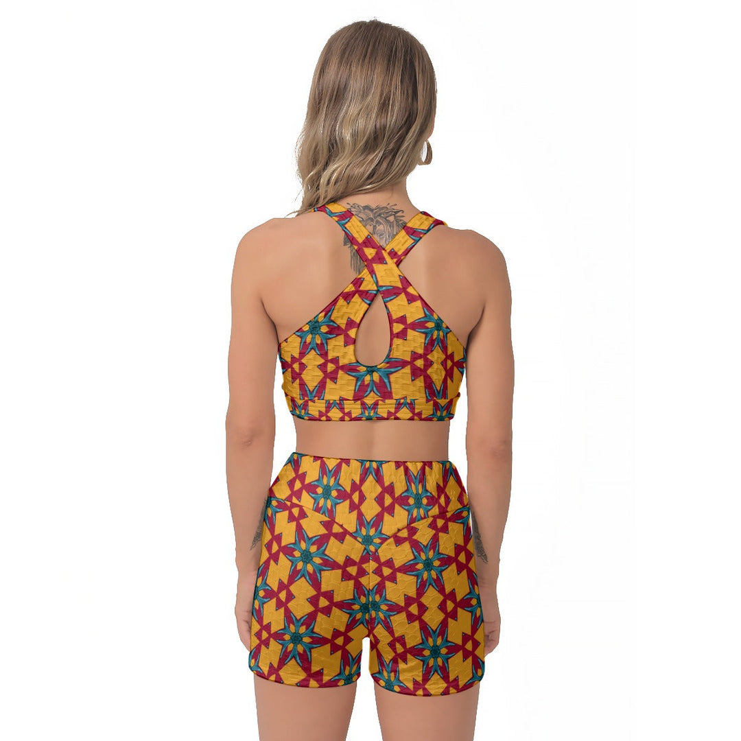 Sea Dragon Dreams women's sports bra and shorts set with a vibrant red and yellow geometric dragon-inspired pattern.