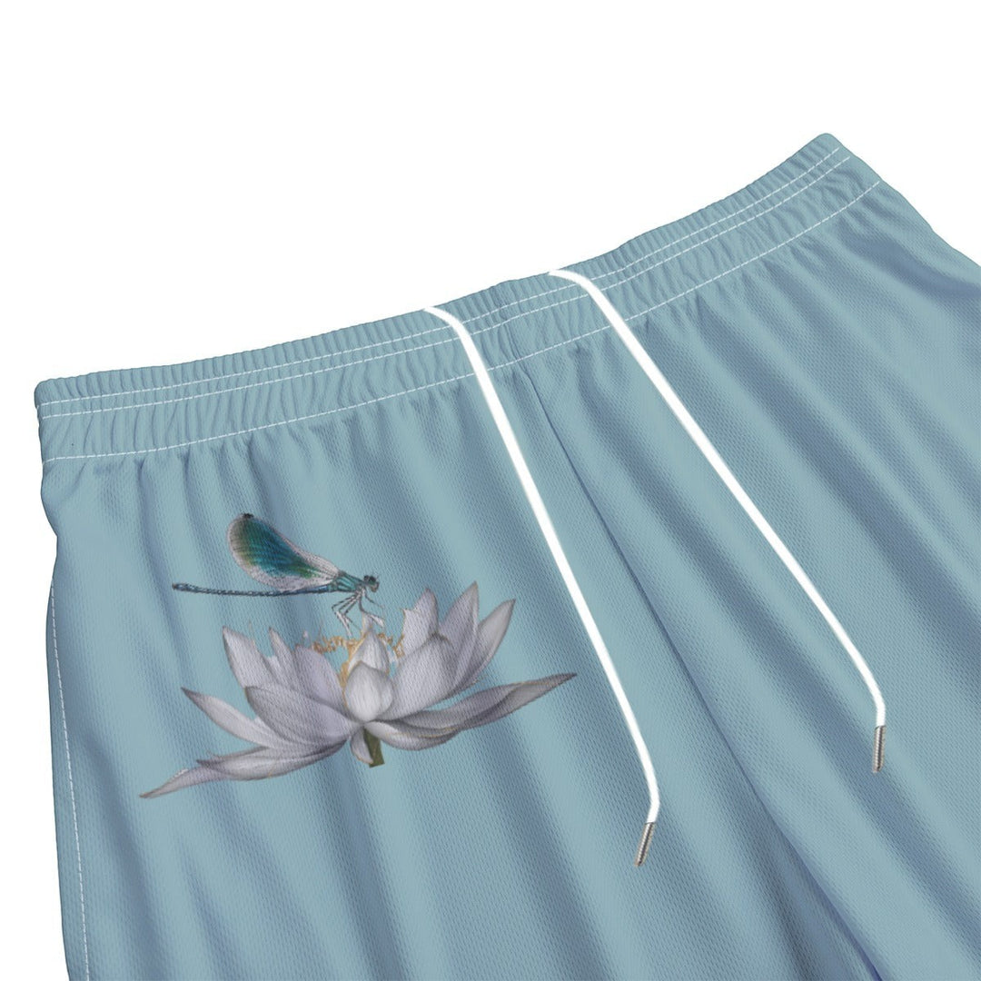 Sea Dragon Dreams men's light blue polyester swim shorts featuring a detailed dragonfly and white lotus flower print.