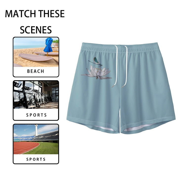 Sea Dragon Dreams men's light blue polyester swim shorts featuring a dragonfly and lotus flower print.