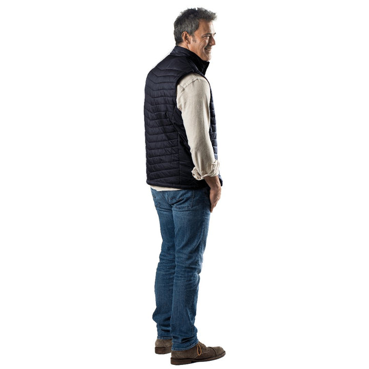 Sea Dragon Dreams Dune men's navy heated vest in lightweight nylon worn by a man in profile view.