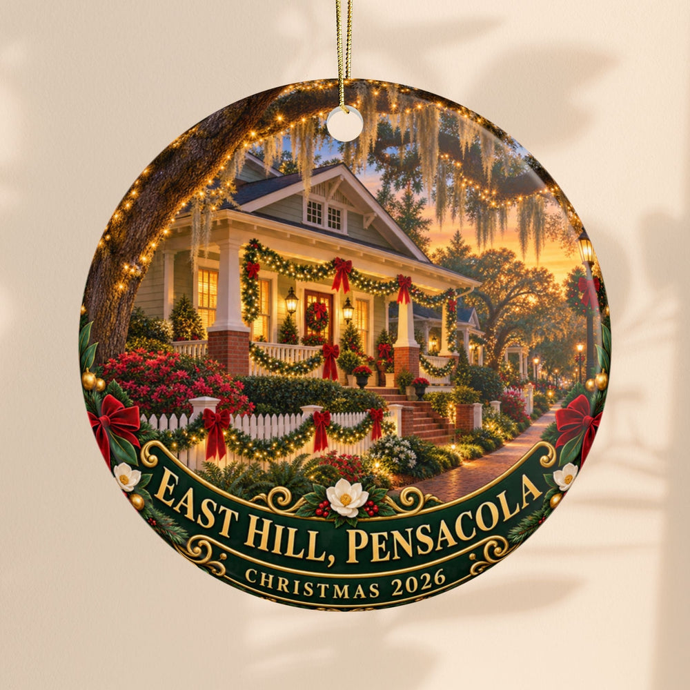 Sea Dragon Dreams ceramic Christmas ornament featuring a festive East Hill Pensacola home scene dated 2026.
