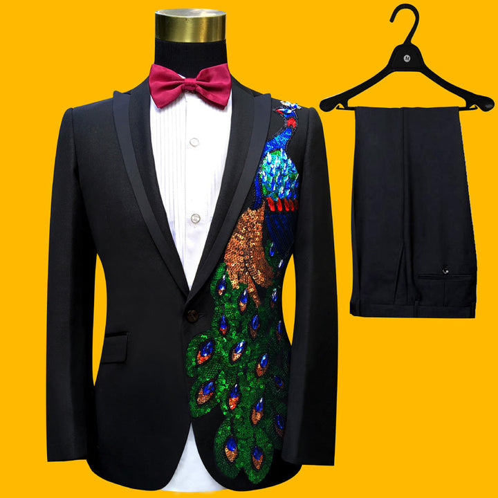 Sea Dragon Dreams black tuxedo suit with vibrant blue and green peacock-inspired sequin embroidery on the blazer