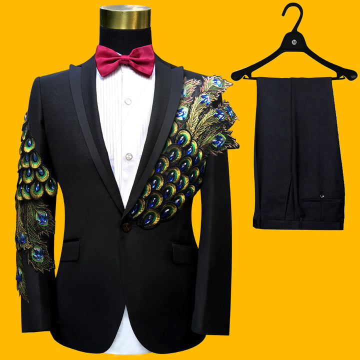 Sea Dragon Dreams black tuxedo suit with blue and green peacock-inspired paillette embroidery on sleeve and chest