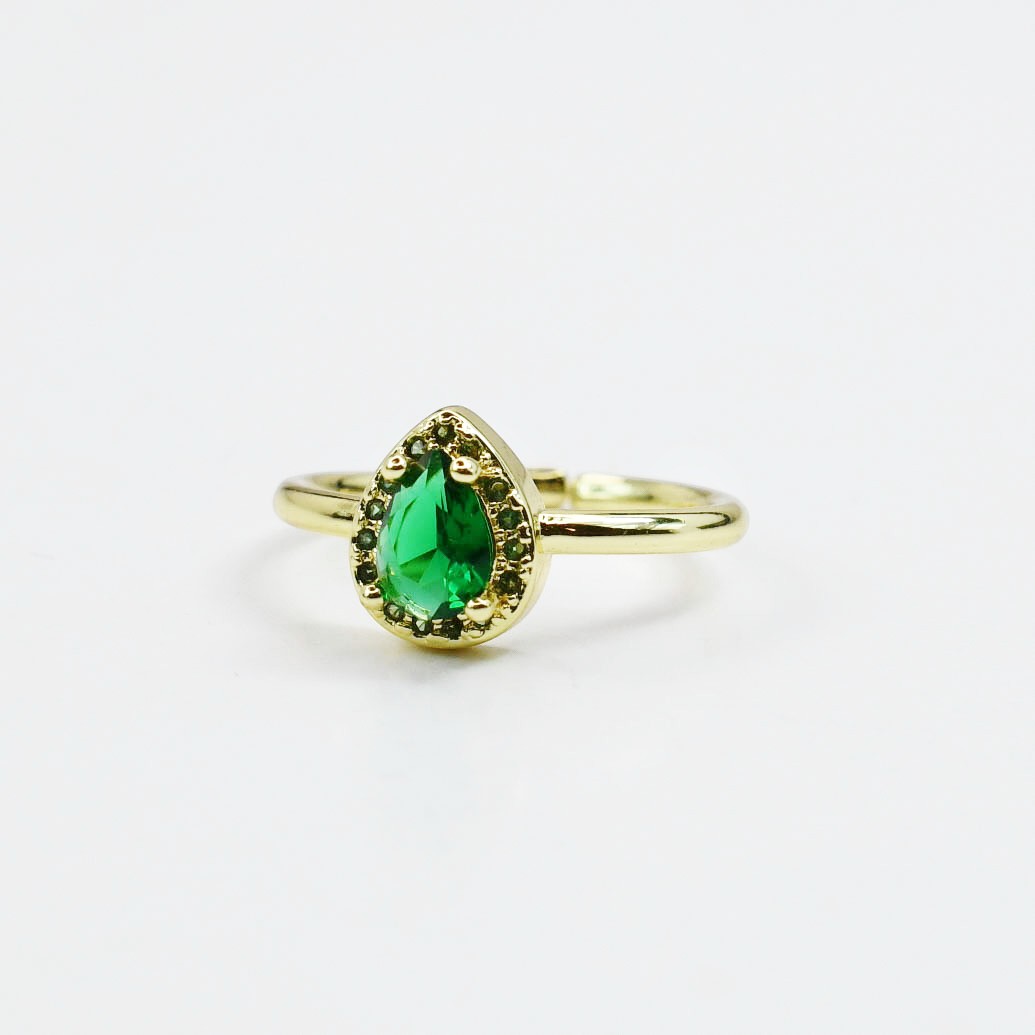 Sea Dragon Dreams adjustable gold-tone ring featuring a teardrop-shaped emerald green crystal centerpiece.