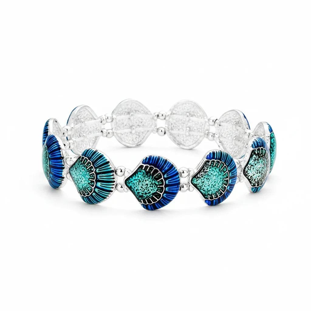 Sea Dragon Dreams enamel shell stretch bracelet featuring blue and teal shell charms on a silver metal band.