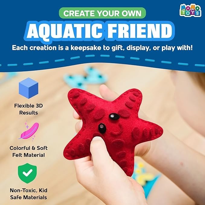 Sea Dragon Dreams MOMOTOYS felt starfish craft from a beginner sewing kit for kids, featuring soft red fabric.