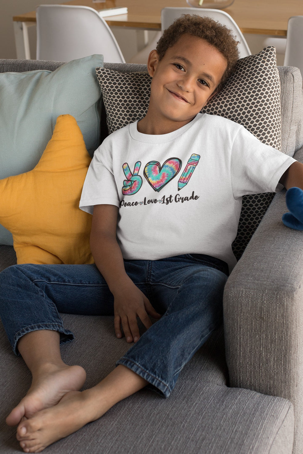 Sea Dragon Dreams youth tee with tie-dye peace sign, heart, and pencil graphic for first grade back to school.