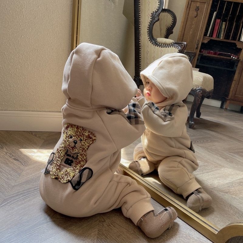 Sea Dragon Dreams baby onesie in coffee brown with a teddy bear design, fleece-lined cotton, and plaid accents.