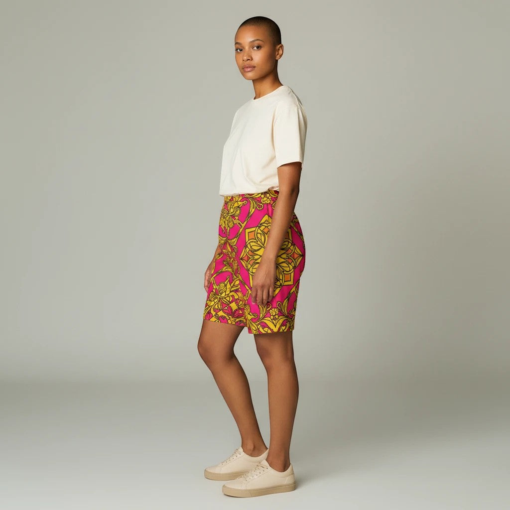 Sea Dragon Dreams women's bike shorts in pink and yellow floral print, worn by a model with a plain cream t-shirt.