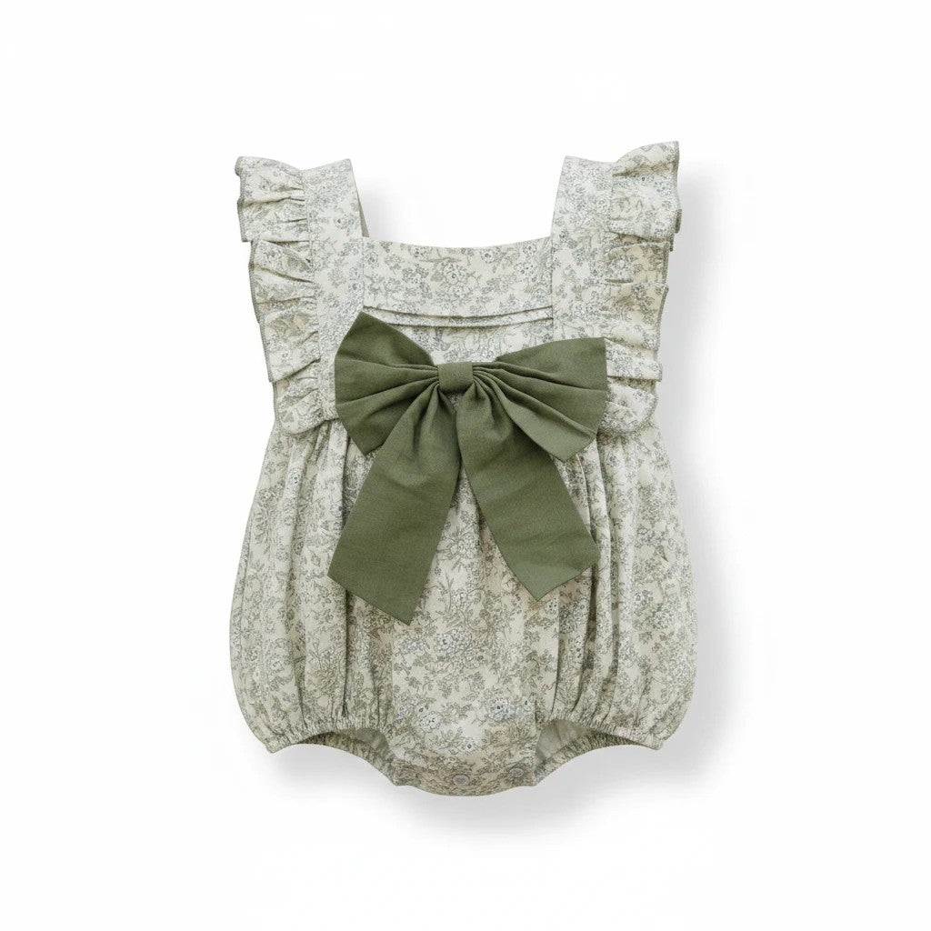 Sea Dragon Dreams bubble romper in blue floral print with ruffled shoulders and a large olive green front bow