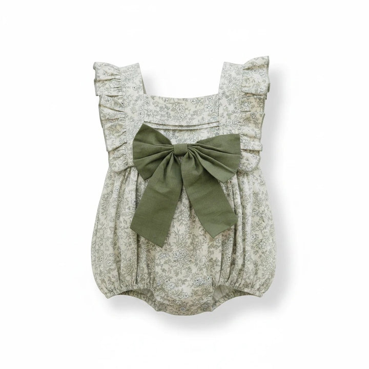 Sea Dragon Dreams bubble romper in blue floral print with ruffled shoulders and a large olive green front bow