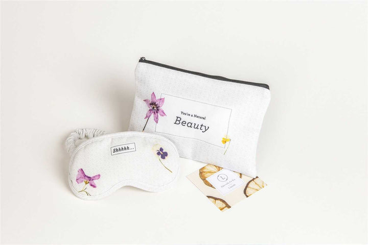 Sea Dragon Dreams floral cosmetic bag and matching sleep mask with botanical prints for a relaxing self-care routine