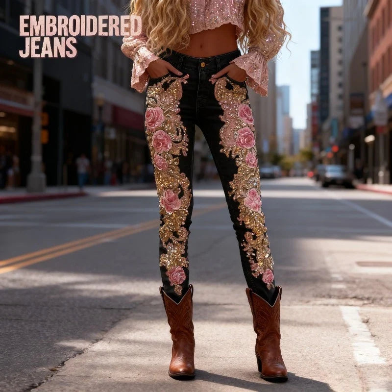 Sea Dragon Dreams black stretch jeans with 3D pink floral embroidery and gold sequin accents worn with brown boots