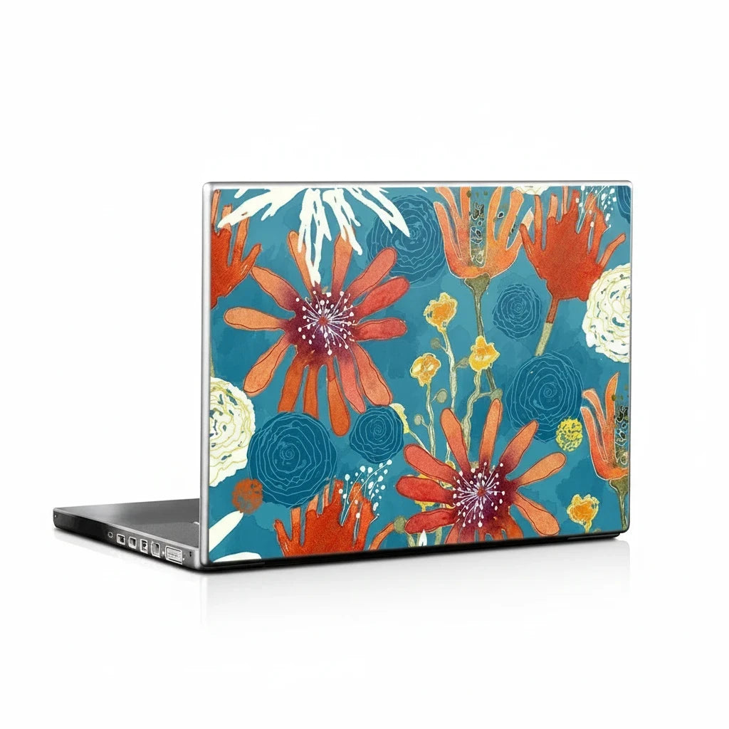 Sea Dragon Dreams laptop skin featuring vibrant orange and yellow floral artwork on a teal background.