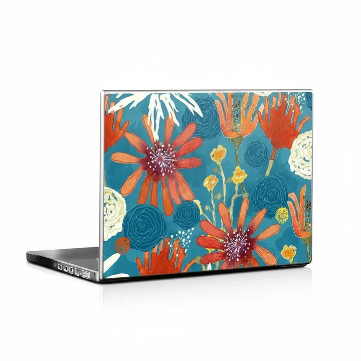 Sea Dragon Dreams laptop skin featuring vibrant orange and yellow floral artwork on a teal background.