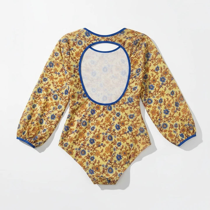 Sea Dragon Dreams plus size long sleeve one-piece swimsuit in yellow floral print with a blue-trimmed open back