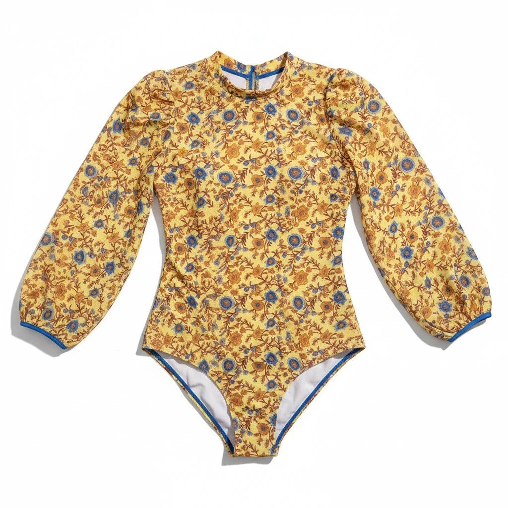 Sea Dragon Dreams plus size long sleeve one-piece swimsuit in yellow floral print with blue trim and puff sleeves