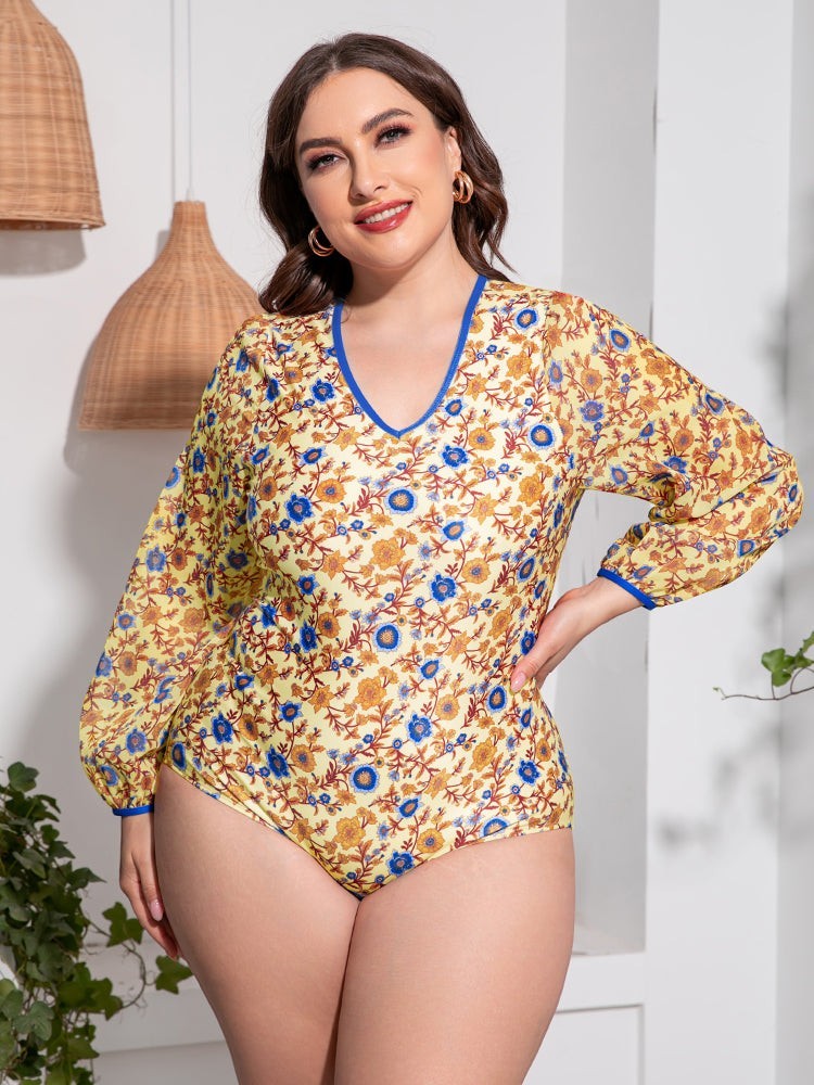 Sea Dragon Dreams plus size long sleeve one-piece swimsuit in yellow with blue and orange floral print and V-neck