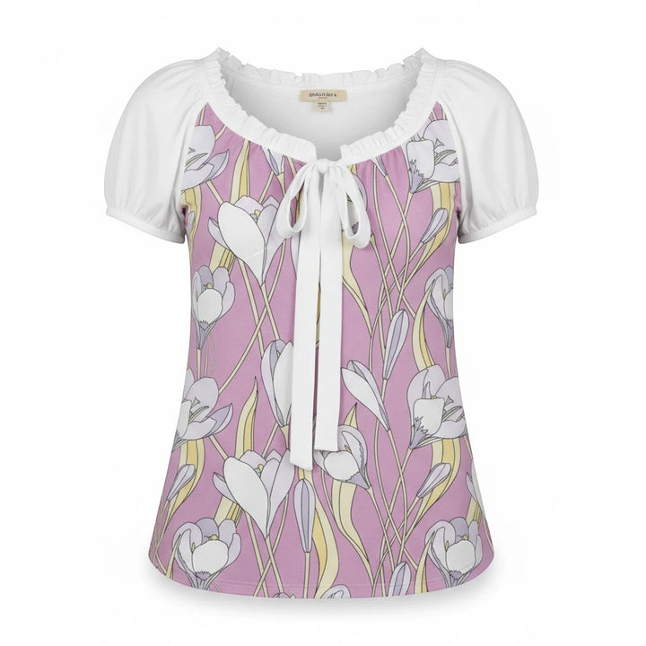 Sea Dragon Dreams floral puff-sleeve blouse with a pink and white crocus pattern and a front tie-neck detail.