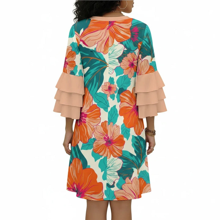 Sea Dragon Dreams floral print dress with stacked ruffle sleeves, back view showing vibrant orange and teal hibiscus