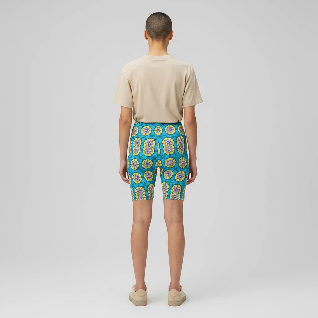 Back view of Sea Dragon Dreams women's workout shorts featuring a vibrant blue and yellow circle flower pattern.