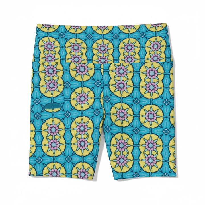 Sea Dragon Dreams women's workout shorts in blue and yellow with a whimsical circle flower pattern and stretch fabric.