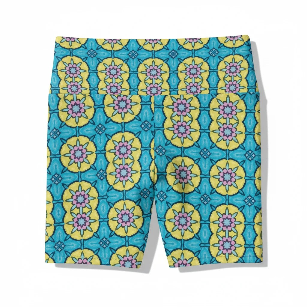 Sea Dragon Dreams women's workout shorts featuring a vibrant blue, yellow, and pink floral circle pattern.