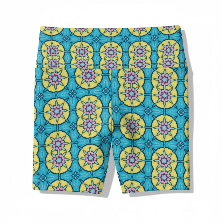 Sea Dragon Dreams women's workout shorts featuring a vibrant blue, yellow, and pink floral circle pattern.