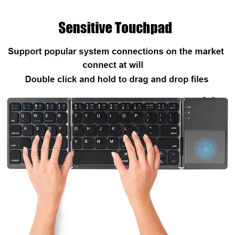 Sea Dragon Dreams foldable Bluetooth keyboard with integrated touchpad being used for typing on a flat surface