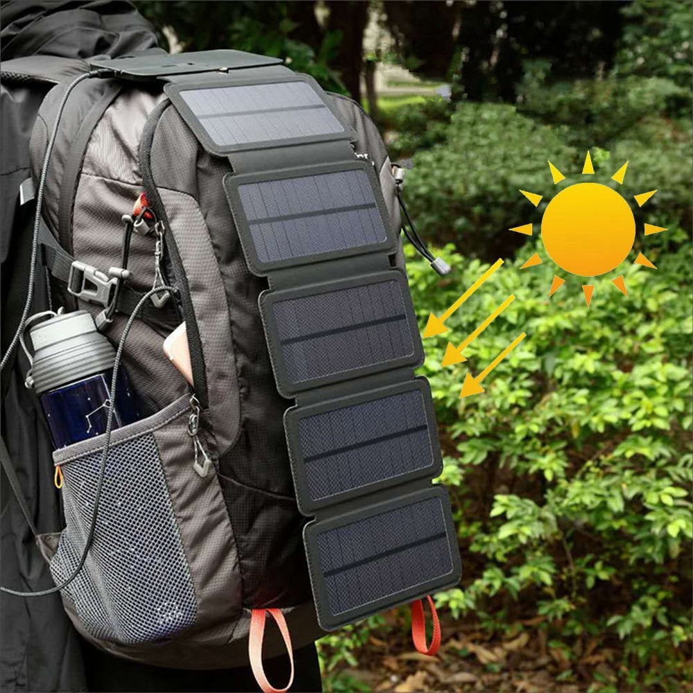 Sea Dragon Dreams portable folding solar panel charger attached to a hiking backpack for outdoor power