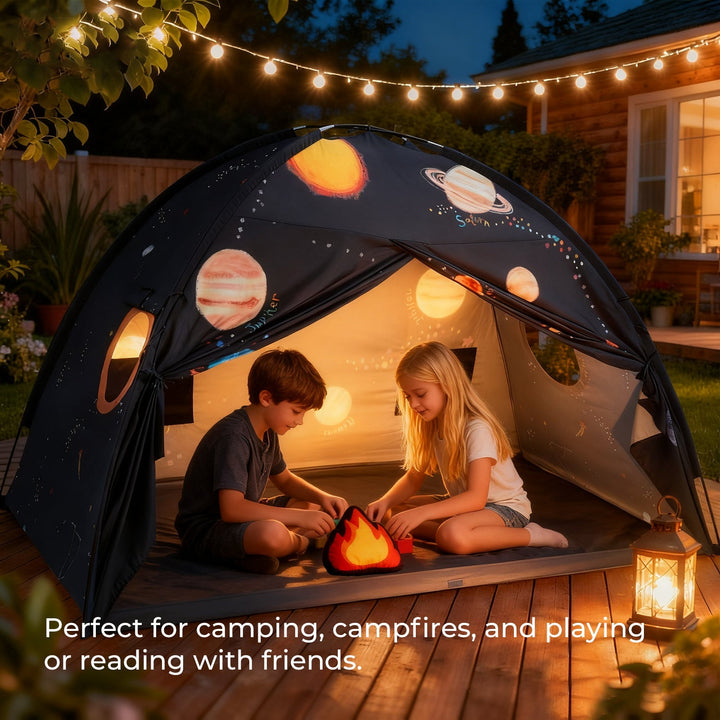 Sea Dragon Dreams galaxy-themed kids play tent with planet prints, set up outdoors with string lights and two children