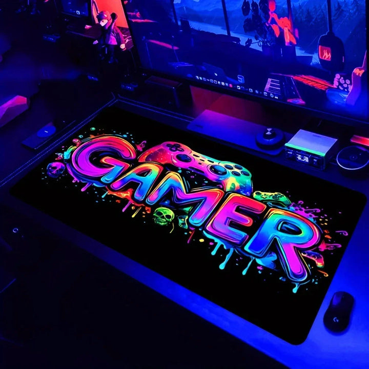 Sea Dragon Dreams XXL gaming mouse pad with neon Gamer text and controller design on a desk with blue lighting