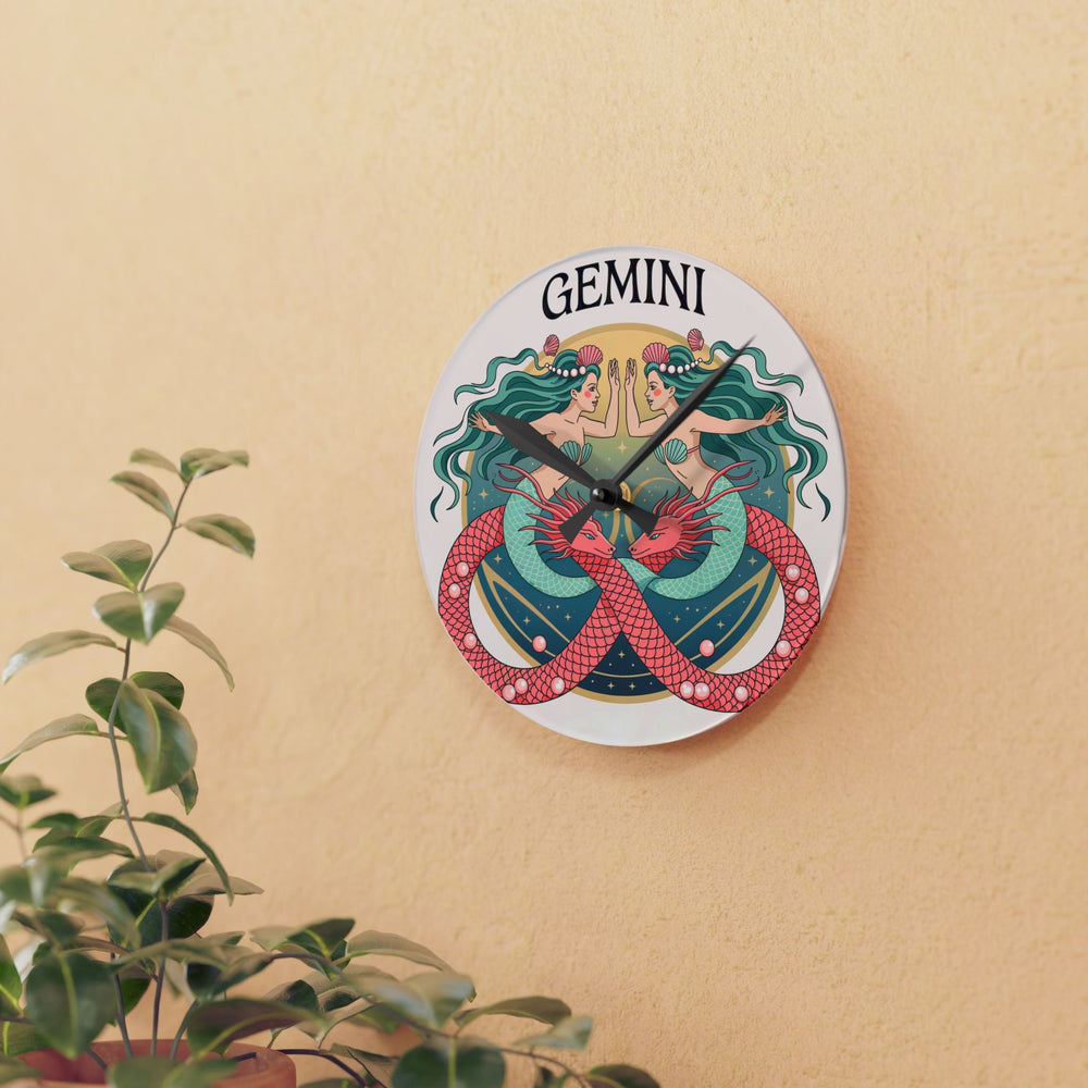 Sea Dragon Dreams round acrylic wall clock featuring a colorful Gemini twin mermaid illustration on a beige wall.