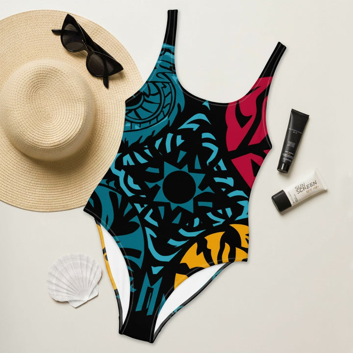 Sea Dragon Dreams one-piece swimsuit with a colorful geometric tribal print, scoop neckline, and cheeky cut.