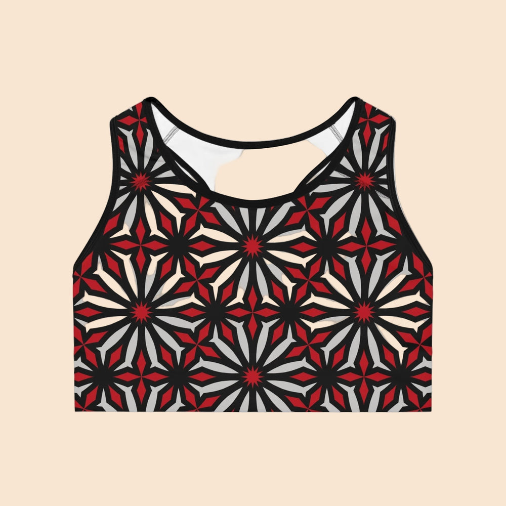 Sea Dragon Dreams Vibrant Geometric sports bra with a seamless racerback design in red, black, and grey patterns.