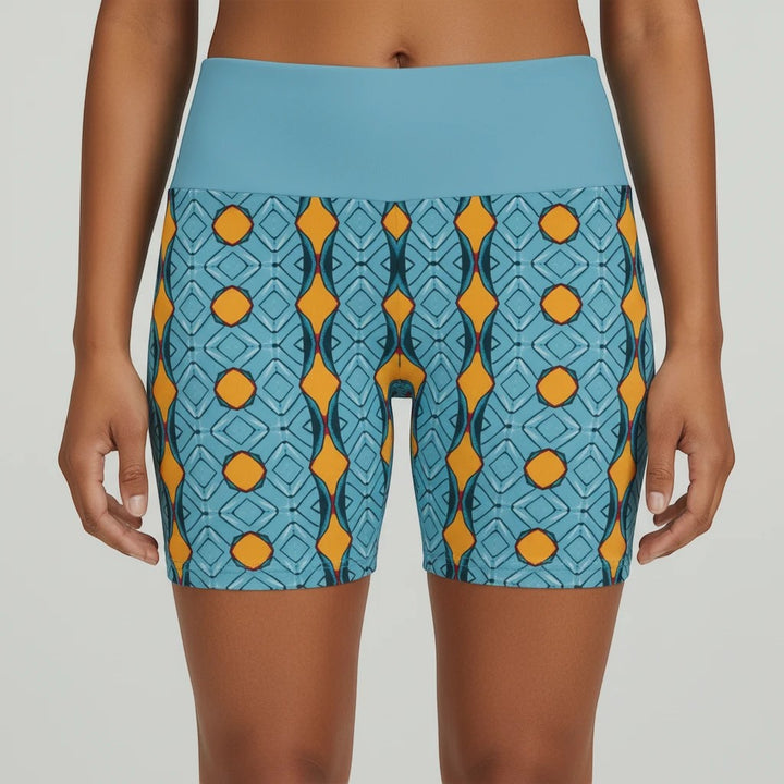 Sea Dragon Dreams women's workout shorts featuring a blue and orange geometric pattern with a solid blue waistband.