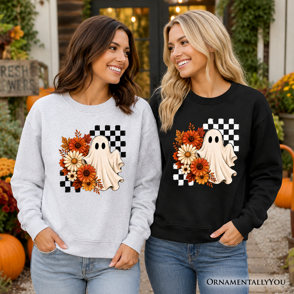 Two women wearing Sea Dragon Dreams sweatshirts with a vintage ghost, checkered, and floral fall design.