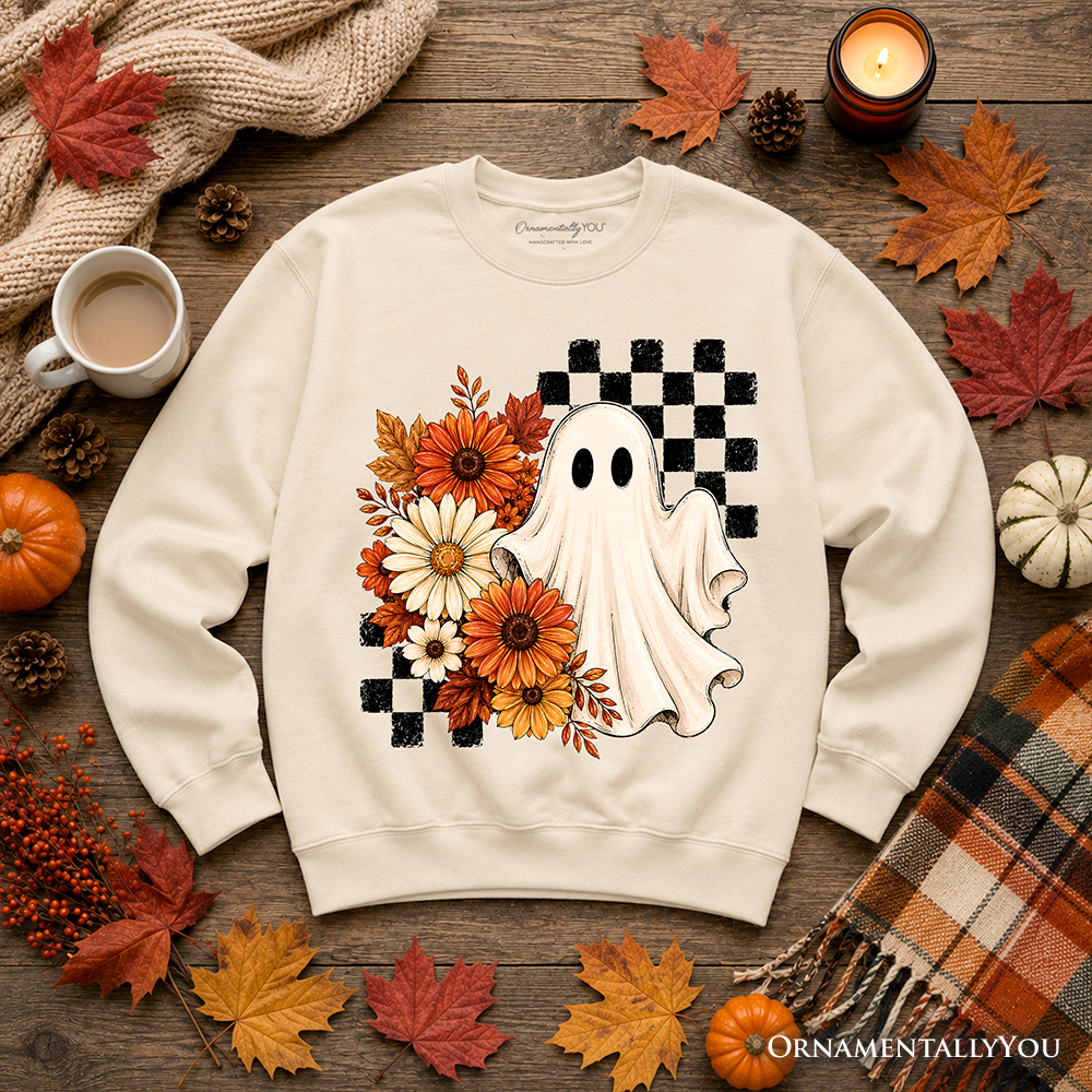 Sea Dragon Dreams cream sweatshirt featuring a ghost, checkered pattern, and fall flowers on a rustic autumn background