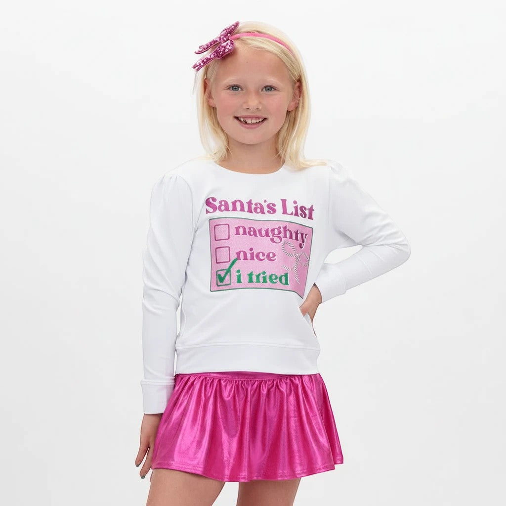 Sea Dragon Dreams white girls Christmas sweatshirt with Santa's List graphic and pink metallic skirt on a young girl