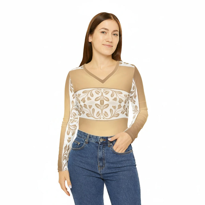 Sea Dragon Dreams long-sleeve V-neck top in cream and gold with a delicate floral baroque leaf pattern.