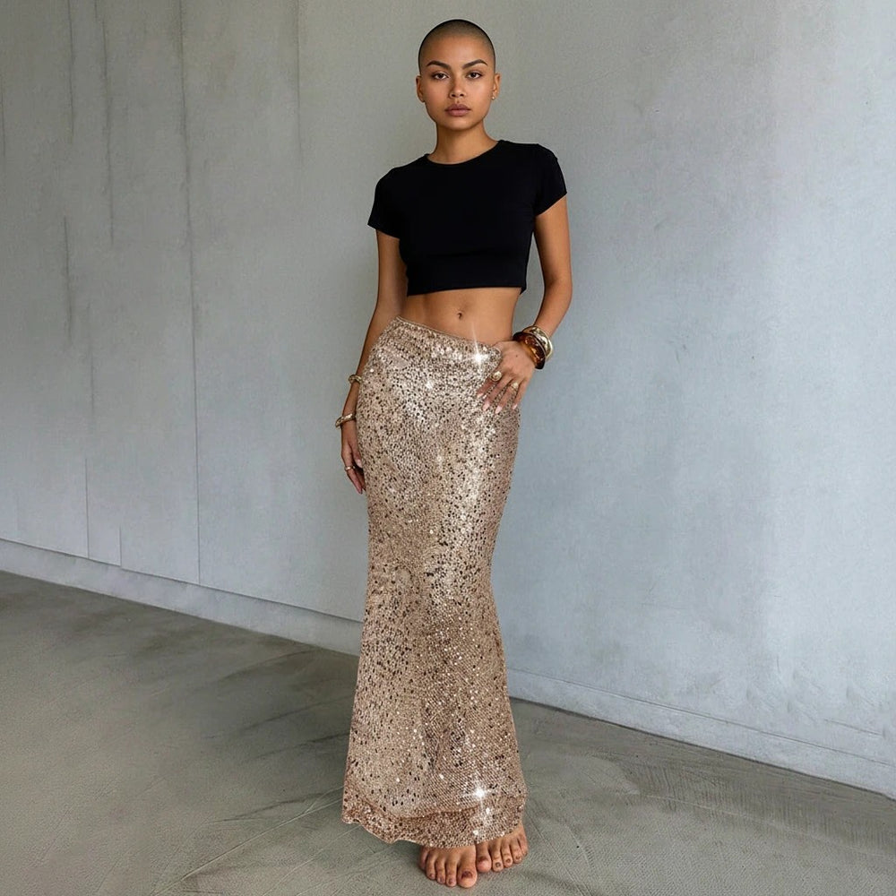 Sea Dragon Dreams gold sequin maxi beach cover-up skirt worn by a model with a black crop top